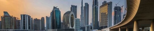 Dubai City skyline from across the water at early sunset