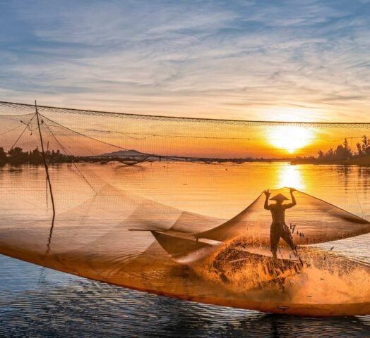 Fishing at sunrise in Vietnam