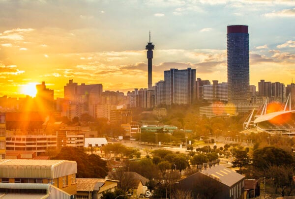 Johannesburg cityscape, taken at sunset, showing Hillbrow residential centre with the prominent Ponte flats and the communications tower.