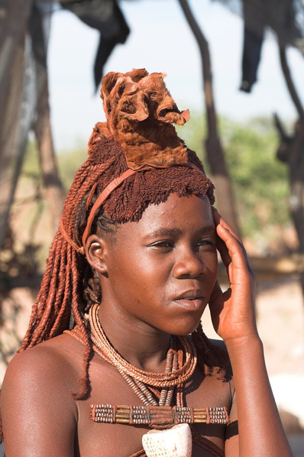 A young woman in traditional Namibian dress and jewellery