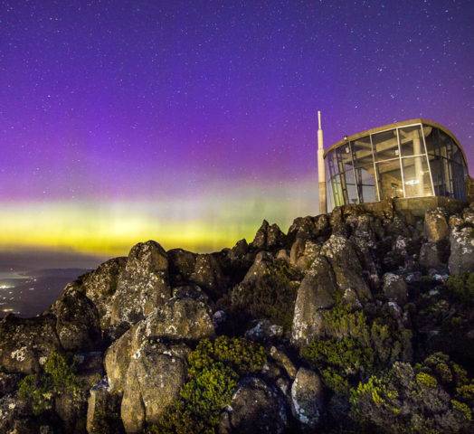 The Aurora Australis visible over the summit of Mt. Wellington/Kunanyi, in Hobart, Tasmania.