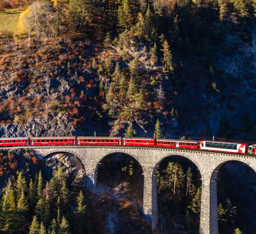 The Gornergrad train running over the Landvasser Viaduct in the Swiss mountains