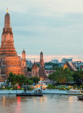 Wat Arun and cruise ship at night, Bangkok, Thailand