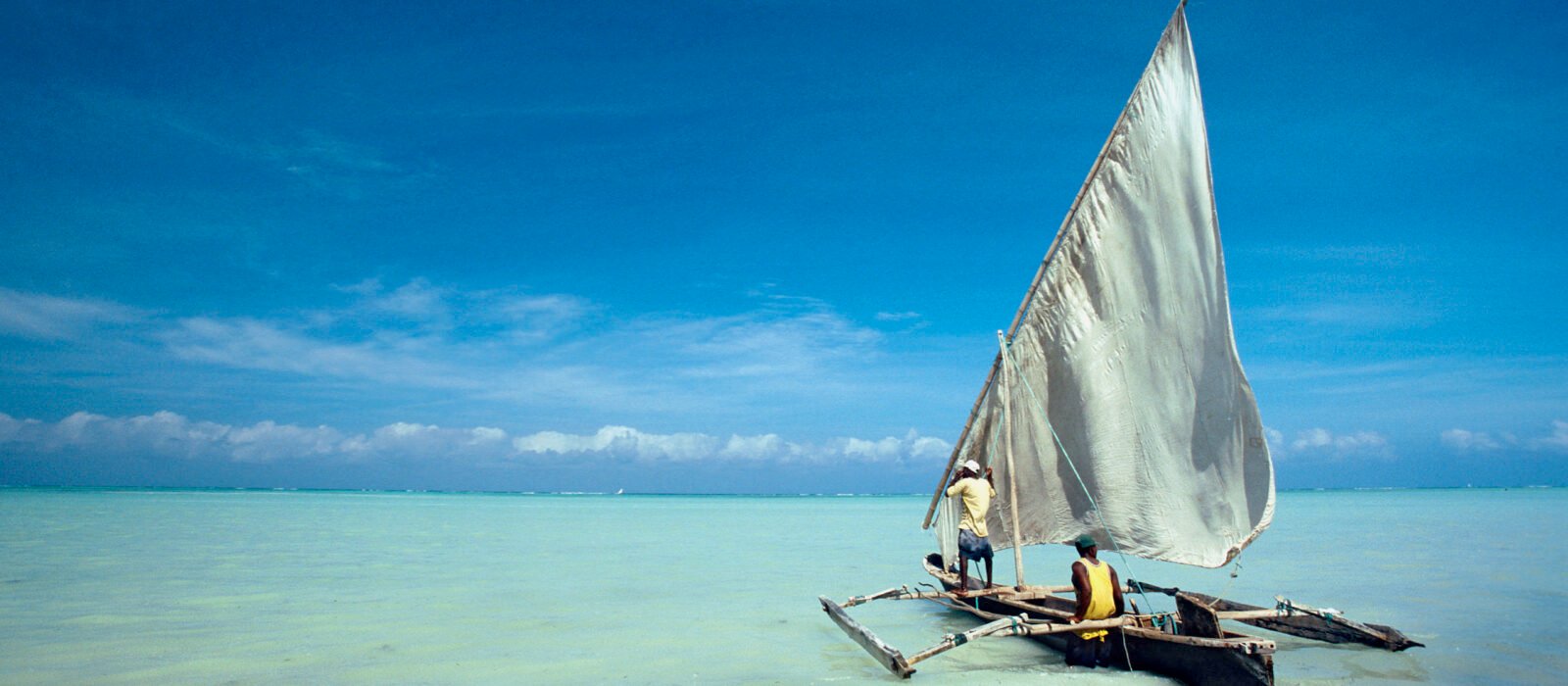 Dhow in the crystal turquoise waters of Zanzibar, Tanzania