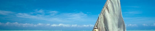 Dhow in the crystal turquoise waters of Zanzibar, Tanzania