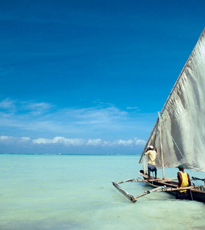 Dhow in the crystal turquoise waters of Zanzibar, Tanzania